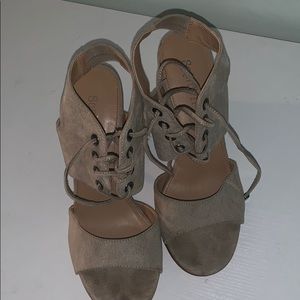 Tie- up, strappy, tan high heels.